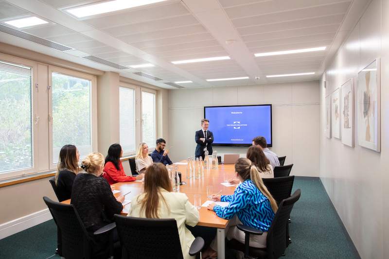 Boardroom style table in a meeting and training room at Kents Hill Park in Milton Keynes